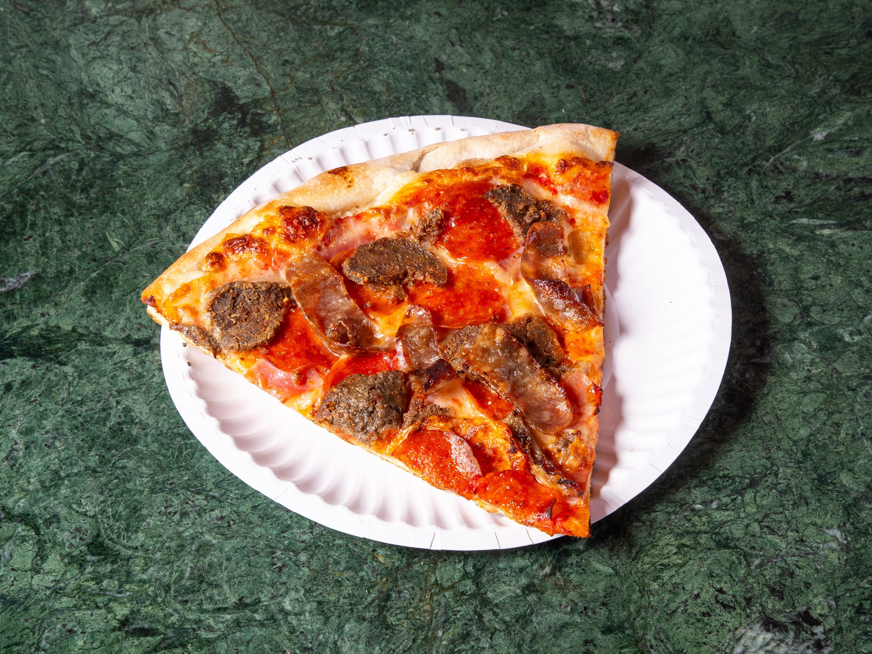 Meat Lovers Slice (Sausage, Pepperoni, Ham).