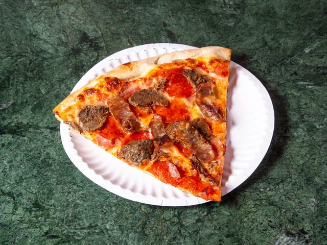 Meat Lovers Slice (Sausage, Pepperoni, Ham).